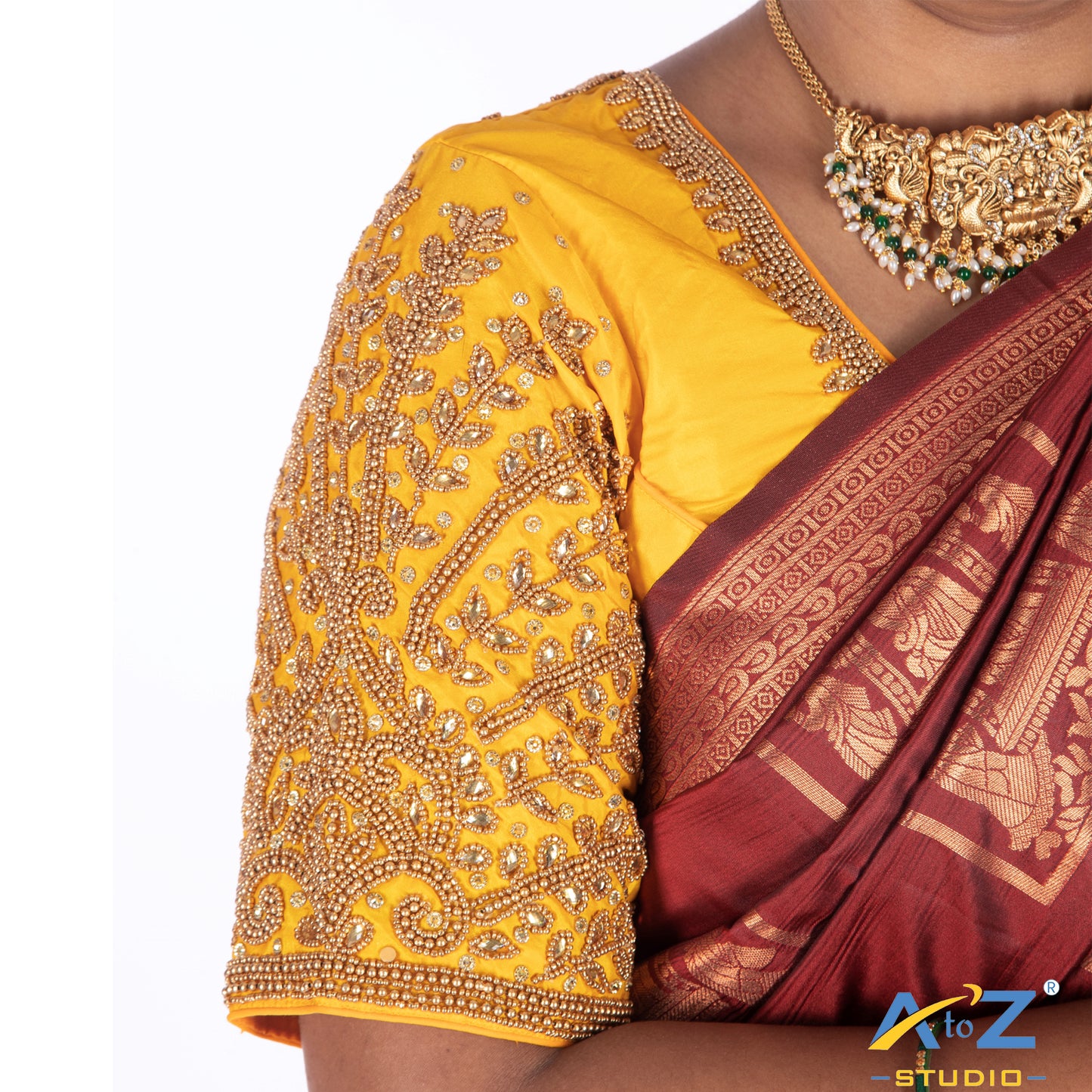Light yellow Silk Cloth Blouse with Small leaf (like flower pot) and chain work Design