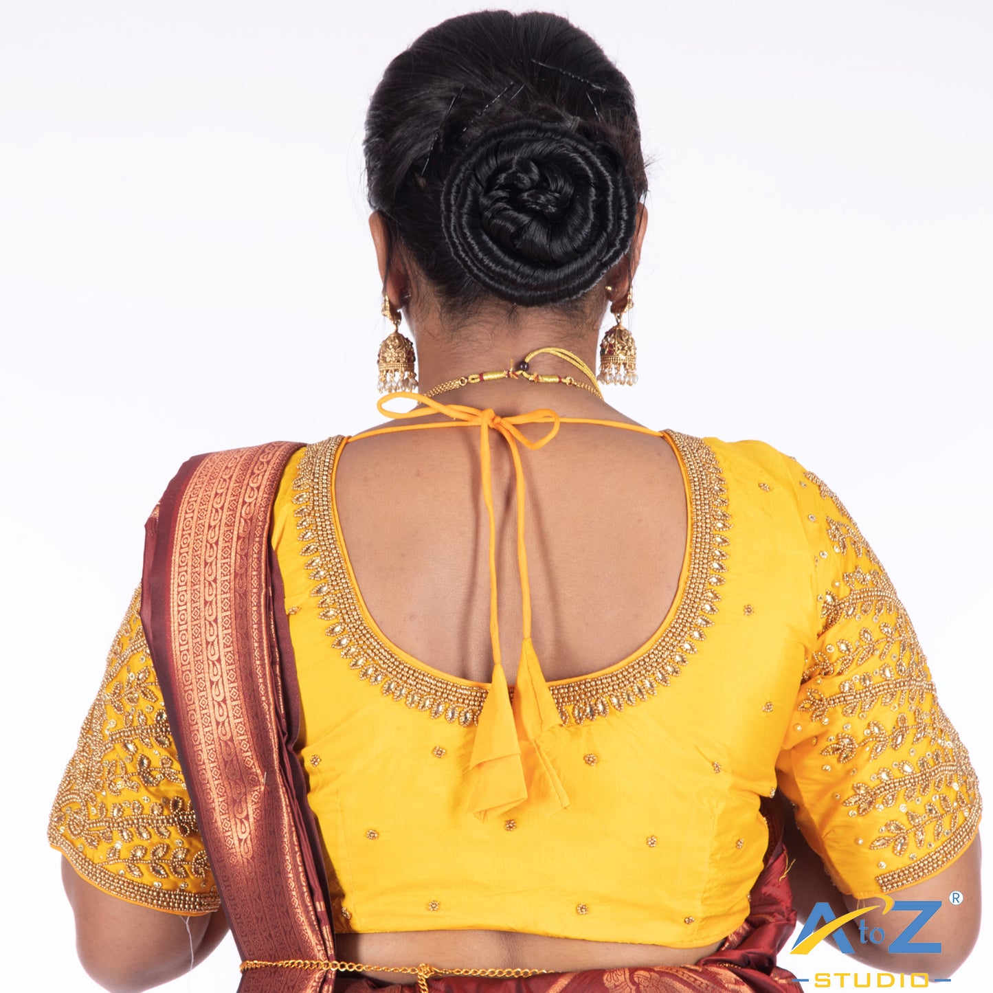 Light yellow Silk Cloth Blouse with Small leaf (like flower pot) and chain work Design