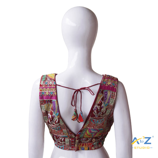 Vibrant Maroon Patchwork Blouse with Intricate Threadwork and Mirror Embellishments