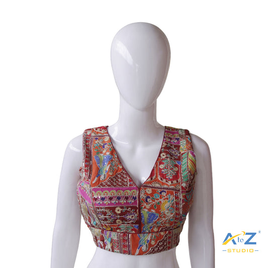 Vibrant Maroon Patchwork Blouse with Intricate Threadwork and Mirror Embellishments